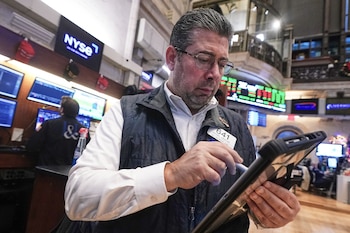 Trader Michael Capolino works on