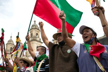 Colombian indigenous people gesture as