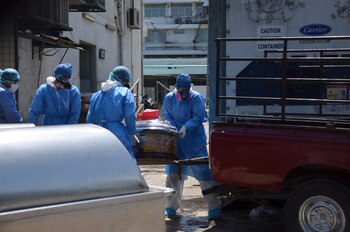 Health workers wearing protective gear