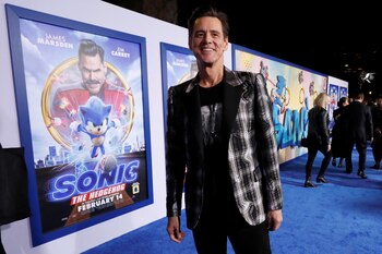 Cast member Jim Carrey poses