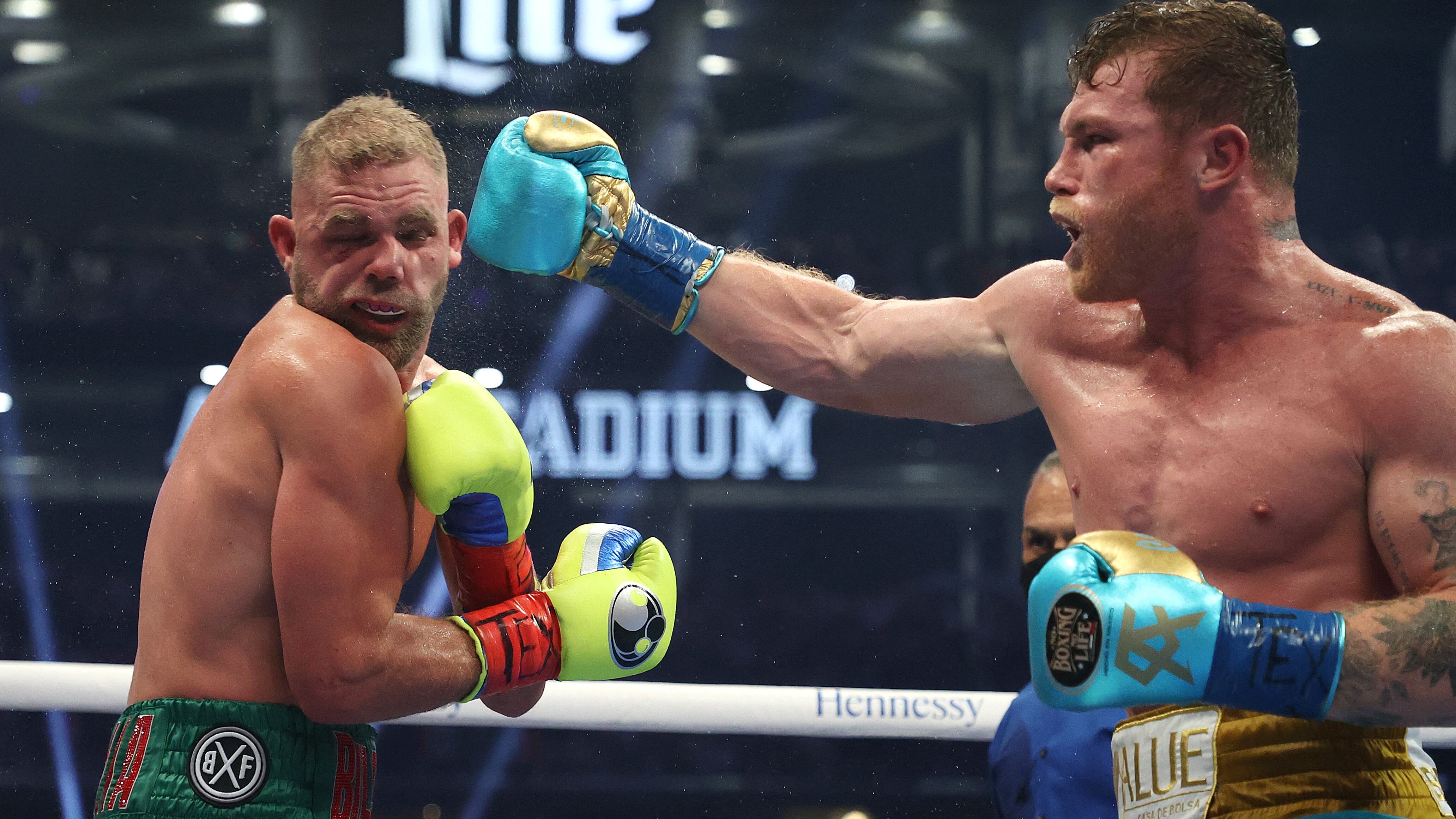 ARLINGTON, TEXAS - MAY 08: Canelo Alvarez punches Billy Joe Saunders during their fight for Alvarez