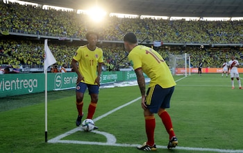 Soccer Football - World Cup - South American Qualifiers - Colombia v Peru - Estadio Metropolitano Roberto Melendez, Barranquilla, Colombia - January 28, 2022 Colombia's Juan Cuadrado with James Rodriguez during the match REUTERS/Luisa Gonzalez