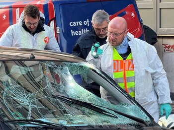 Forensic experts work on a