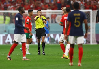 Soccer Football - FIFA World Cup Qatar 2022 - Semi Final - France v Morocco - Al Bayt Stadium, Al Khor, Qatar - December 14, 2022 Referee Cesar Arturo Ramos blows his whistle during the match REUTERS/Kai Pfaffenbach