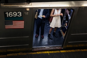 People wait for a subway train to depart Union Square station, in New York City, U.S., June 1, 2025. REUTERS/Kevin Coombs
