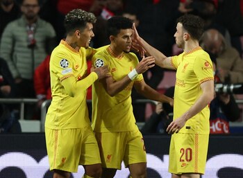 Soccer Football - Champions League - Quarter Final - First Leg - Benfica v Liverpool - Estadio da Luz, Lisbon, Portugal - April 5, 2022 Liverpool's Luis Diaz celebrates scoring their third goal with teammates Action Images via Reuters/Matthew Childs