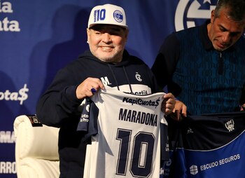 FILE PHOTO: Soccer Football - Argentina - La Plata, Argentina - September 8, 2019 President of Gimnasia y Esgrima Gabriel Pellegrino and Diego Maradona during his presentation as new coach REUTERS/Agustin Marcarian/File Photo
