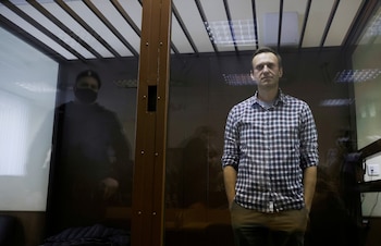 FILE PHOTO: Russian opposition leader Alexei Navalny attends a hearing to consider an appeal against an earlier court decision to change his suspended sentence to a real prison term, in Moscow, Russia February 20, 2021. REUTERS/Maxim Shemetov/File Photo/File Photo