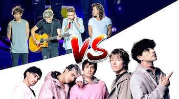 Cuatro miembros de One Direction en concierto en la parte superior, cinco hombres con vestimenta casual en la inferior y un gráfico 'VS' rojo en el centro.