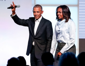 FILE PHOTO: Former U.S. President Barack Obama and former first lady Michelle Obama greet guests during the first day of the Obama Foundation Summit in Chicago, Illinois, U.S. October 31, 2017. REUTERS/Kamil Krzaczynski/File Photo