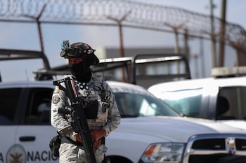 A member of the National Guard keeps watch outside the Altiplano high security prison where ex-Gulf Cartel chief Osiel Cardenas is imprisoned after being deported from the U.S., in Almoloya de Juarez, Mexico December 17, 2024. REUTERS/Luis Cortes