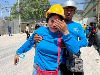 A worker reacts near a site of a collapsed building after the tremors of a strong earthquake that struck central Myanmar on Friday affected Bangkok, Thailand, March 28, 2025. REUTERS/Ann Wang TPX IMAGES OF THE DAY