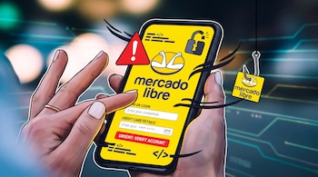 Mano sostiene teléfono móvil con pantalla amarilla de Mercado Libre que pide datos. Triángulo de advertencia, candado roto y anzuelo de phishing con el logo de Mercado Libre.