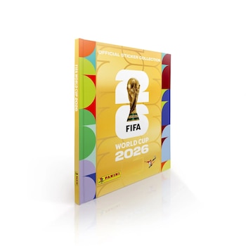 Álbum oficial de figuritas FIFA World Cup 2026 de Panini, de pie sobre una superficie blanca. Portada amarilla con el trofeo y el número '26'