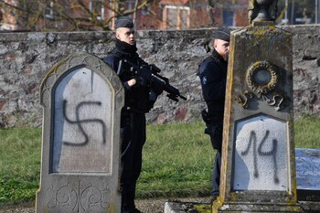 French policemen stand guards on