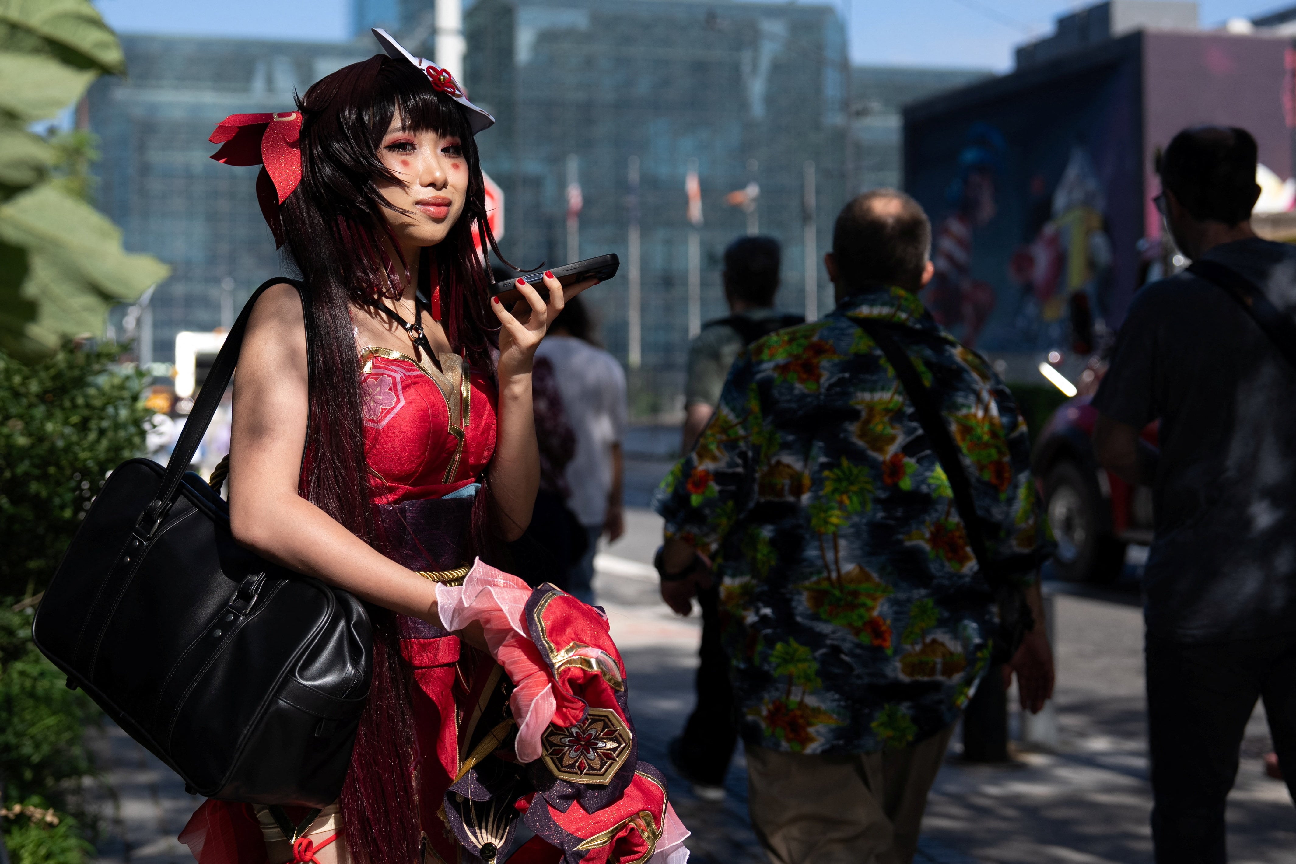 A person speaks on the phone in costume at Anime NYC, New York City's anime convention, at the Jacob K. Javits Convention Center in New York, U.S., August 21, 2026. REUTERS/David Dee Delgado