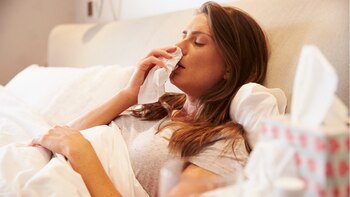 Woman Suffering From Cold Lying