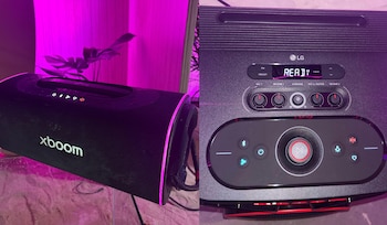 Un altavoz portátil negro LG XBOOM con luz rosa a la izquierda y el panel de control de un equipo de audio LG con pantalla digital a la derecha