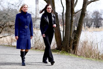 Sweden's Prime Minister Magdalena Andersson walks with Finland's Prime Minister Sanna Marin prior to a meeting, amid Russia's invasion of Ukraine, in Stockholm, Sweden, April 13, 2022. Paul Wennerholm/TT News Agency/via REUTERS ATTENTION EDITORS - THIS IMAGE WAS PROVIDED BY A THIRD PARTY. SWEDEN OUT. NO COMMERCIAL OR EDITORIAL SALES IN SWEDEN.