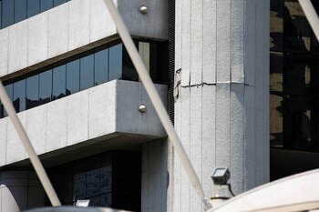 A crack is seen on a building after a strong earthquake struck central Myanmar on Friday, earthquake monitoring services said, which affected Bangkok as well with hundreds of people pouring out of buildings in the Thai capital in panic after the tremors, in Bangkok, Thailand, March 28, 2025. REUTERS/Athit Perawongmetha