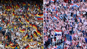 Multitudes de aficionados al fútbol divididas en un estadio. A la izquierda, hinchas con banderas de Alemania. A la derecha, hinchas con banderas de Paraguay
