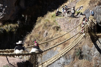 Members of the Huinchiri community rebuild an Incan hanging bridge, known as the Qeswachaka bridge, using traditional weaving techniques in Canas, Peru, June 13, 2021. Picture taken June 13, 2021. Cusco Regional Government/Handout via REUTERS ATTENTION EDITORS - THIS IMAGE HAS BEEN SUPPLIED BY A THIRD PARTY. NO RESALES. NO ARCHIVES