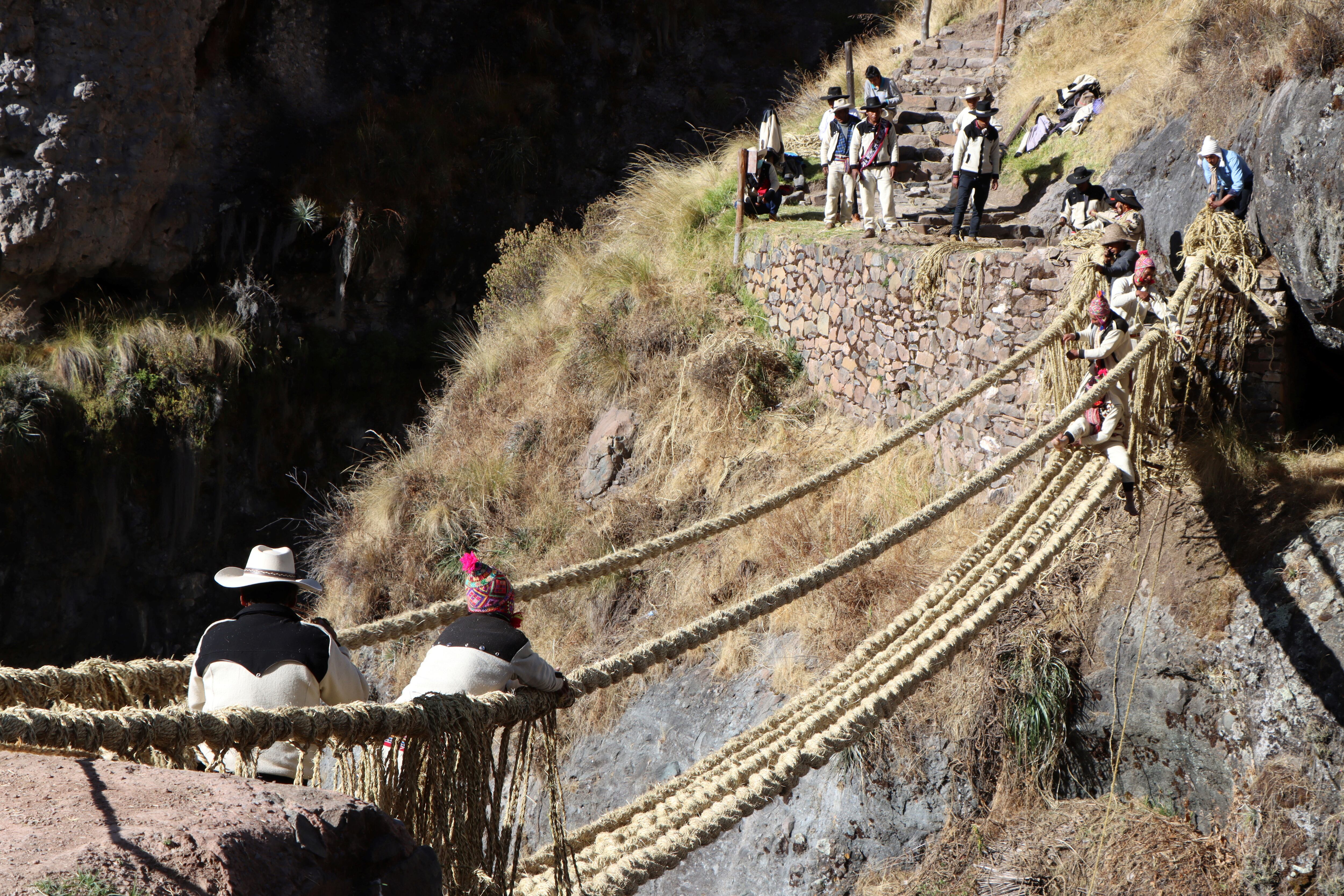 Members of the Huinchiri community rebuild an Incan hanging bridge, known as the Qeswachaka bridge, using traditional weaving techniques in Canas, Peru, June 13, 2021. Picture taken June 13, 2021. Cusco Regional Government/Handout via REUTERS ATTENTION EDITORS - THIS IMAGE HAS BEEN SUPPLIED BY A THIRD PARTY. NO RESALES. NO ARCHIVES