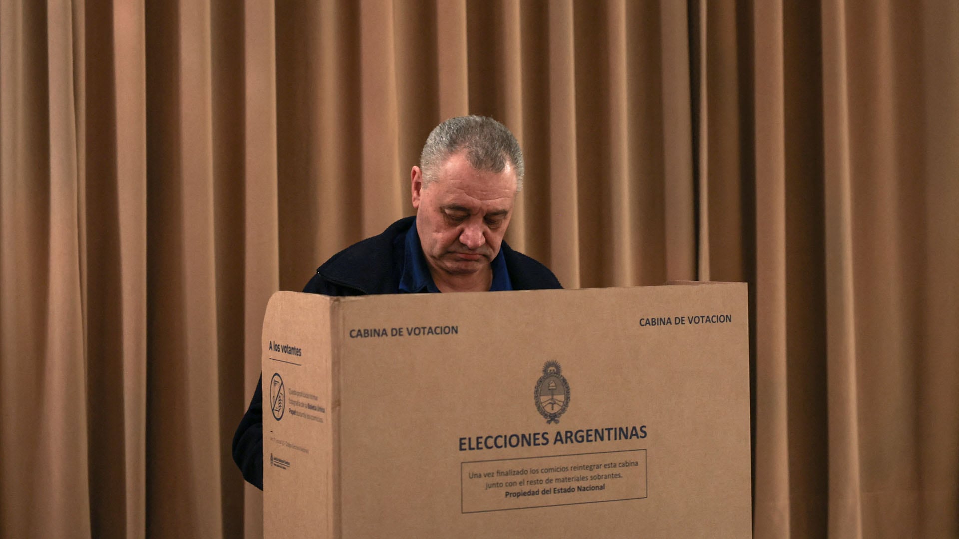 A man votes at a polling station during the midterm election, in Buenos Aires, Argentina, October 26, 2025. REUTERS/Cristina Sille