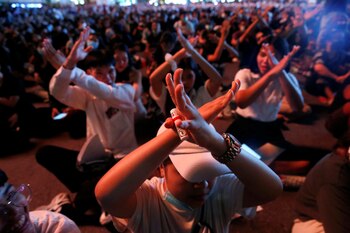 People gesture during anti-government protests,
