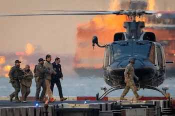 FILE — Nicolas Maduro, left, the ousted president of Venezuela, is escorted off a helicopter en route to the federal courthouse in Manhattan on Jan. 5, 2026. As Cilia Flores, the wife of the ousted Venezuelan leader Nicolás Maduro, has sat in a Brooklyn jail cell, she has experienced a few of the issues that plague America’s troubled federal lockups. (Vincent Alban/The New York Times)