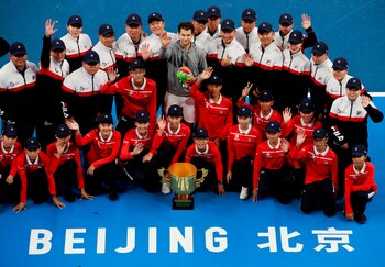 Austria's Dominic Thiem (C) poses