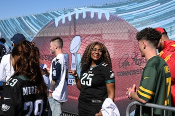 Football fans wait in line