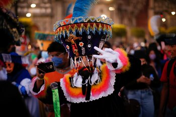 Participant in traditional costume attends