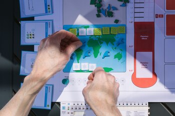 A prototype of the new board game designed by Matthew Leacock in which players work together to mitigate climate change, in Sunnyvale, Calif., March 22, 2021. Leacock, the inventor of the hit board game Pandemic, has spent the past year making a game about an even weightier subject: climate change. (Peter Prato/The New York Times)