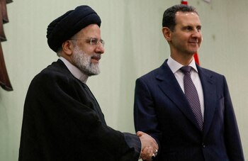 Bashar al-Assad junto a Raisi