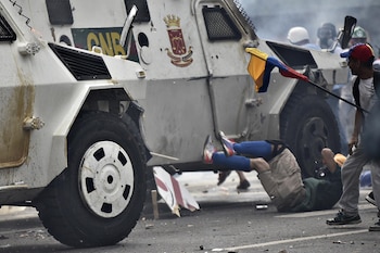Manifestantes atropellados en Venezuela (AFP)