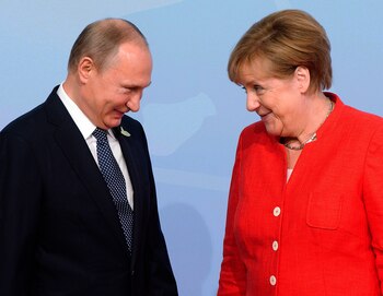 Vladimir Putin y Angela Merkel
