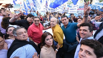 Carlos Menem junto a Beder Herrera y Sergio Casas