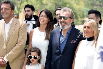 Sonrientes junto a su hija