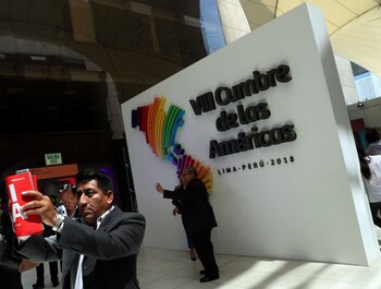 People take selfies in front