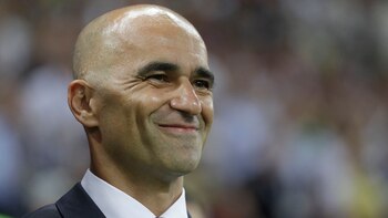 Belgium coach Roberto Martinez smiles as he waits for the start of the quarterfinal match between Brazil and Belgium at the 2018 soccer World Cup in the Kazan Arena, in Kazan, Russia, Friday, July 6, 2018. (AP Photo/Matthias Schrader)