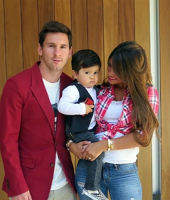 Lionel Messi con Thiago y
