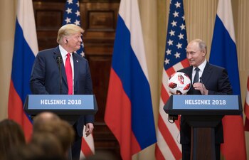 President Donald Trump (left) smiles