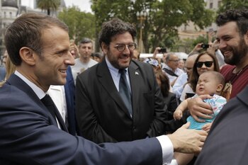 France’s President Emmanuel Macron greets