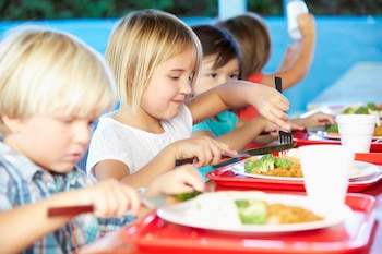 Elementary Pupils Enjoying Healthy Lunch