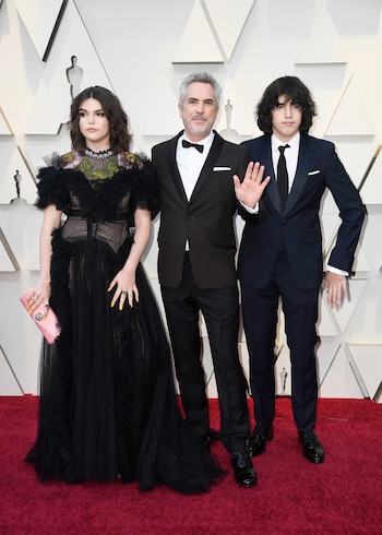 Alfonso Cuarón con dos de sus