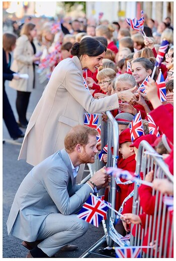 Harry y Meghan saludando a