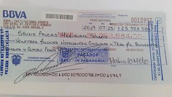 Cheque por 23.953,58 pesos para
